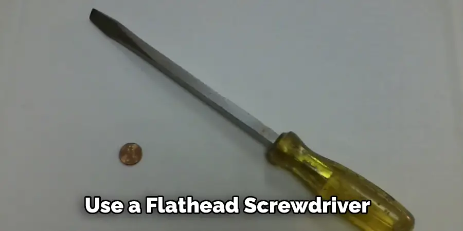 Use a Flathead Screwdriver