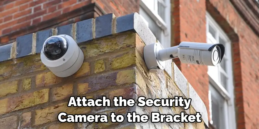 attach the security camera to the bracket