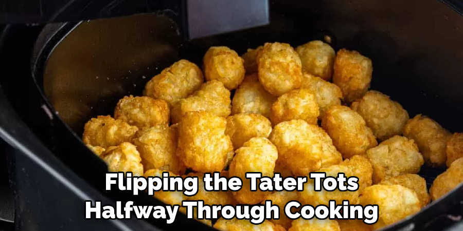 Flipping the Tater Tots Halfway Through Cooking