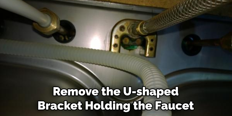 Remove the U-shaped Bracket Holding the Faucet