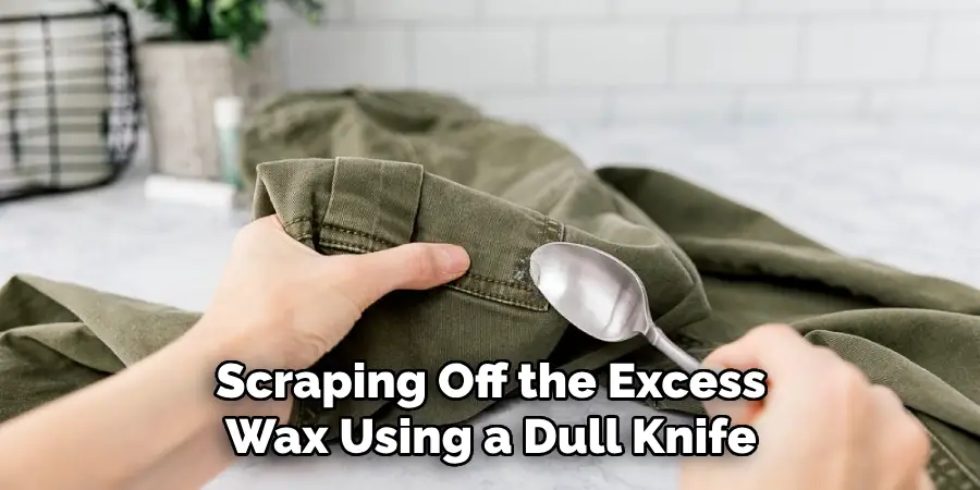 Scraping Off the Excess Wax Using a Dull Knife