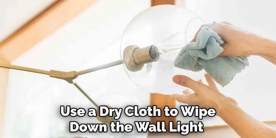 Use a Dry Cloth to Wipe Down the Wall Light 