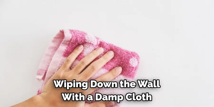 Wiping Down the Wall 
With a Damp Cloth