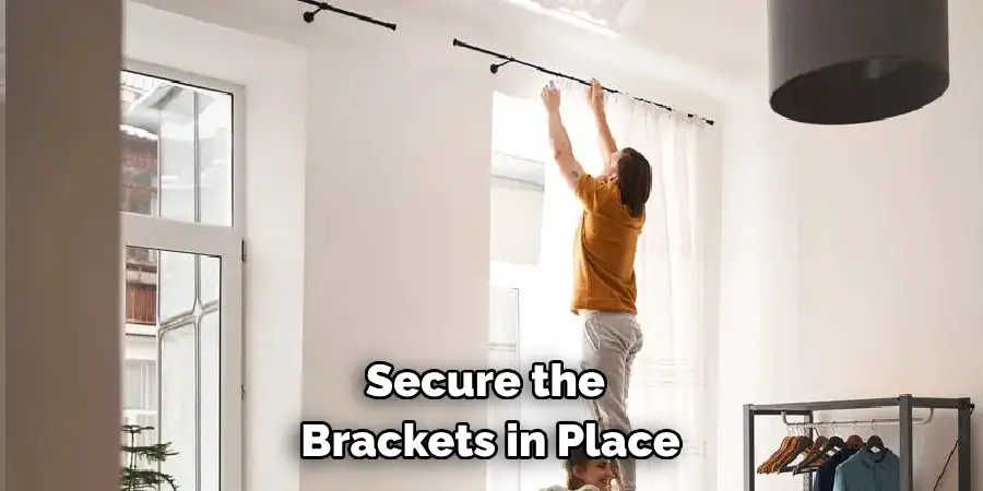 secure the brackets in place