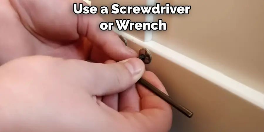  Use a Screwdriver
 or Wrench 