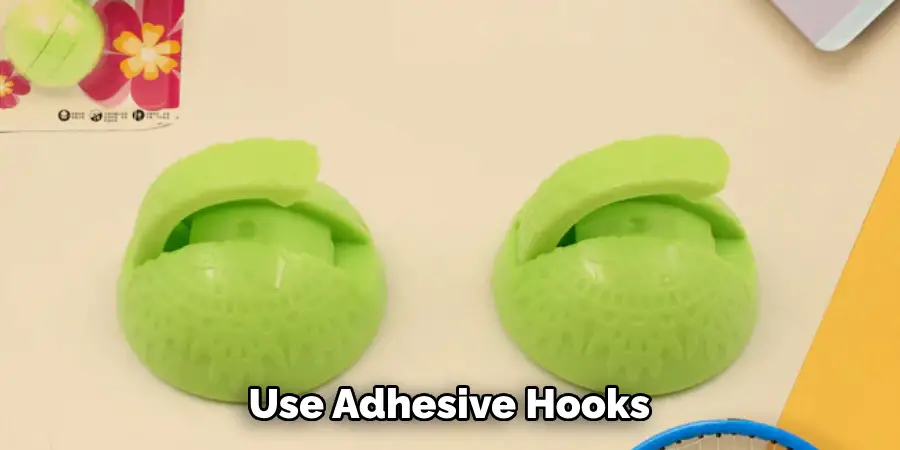 Use Adhesive Hooks